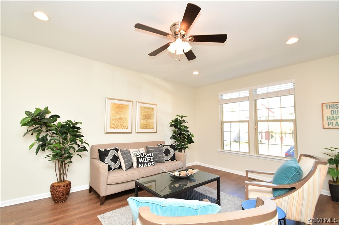 5509 Riverside Heights Way Richmond, VA 23225 - Photo 2 of 28 a living room with furniture and a large window