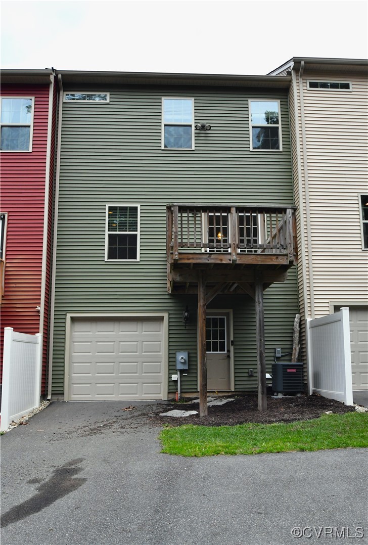 5509 Riverside Heights Way Richmond, VA 23225 - Photo 24 of 28 a view of a house with small yard and a large parking space