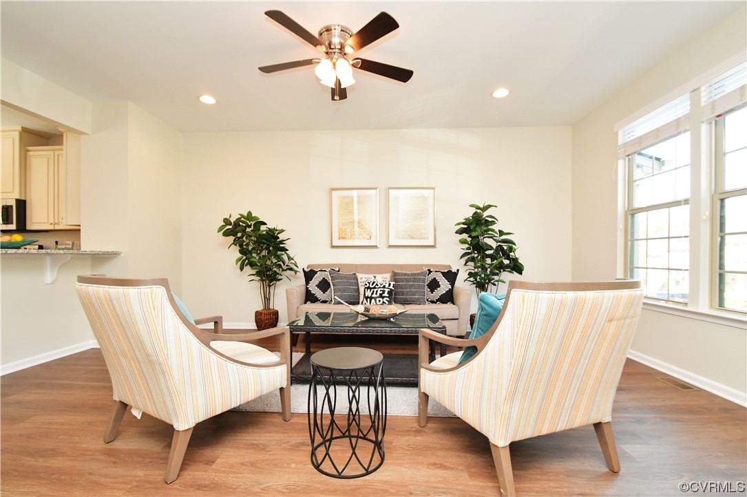 5509 Riverside Heights Way Richmond, VA 23225 - Photo 3 of 28 a living room with furniture and wooden floor