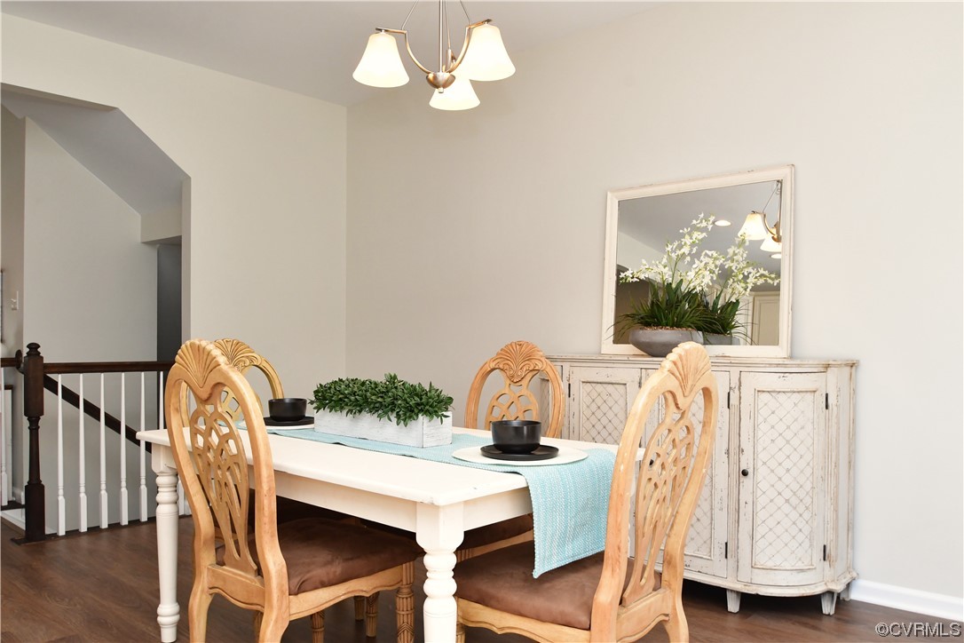5509 Riverside Heights Way Richmond, VA 23225 - Photo 9 of 28 a view of a dining room with furniture and wooden floor