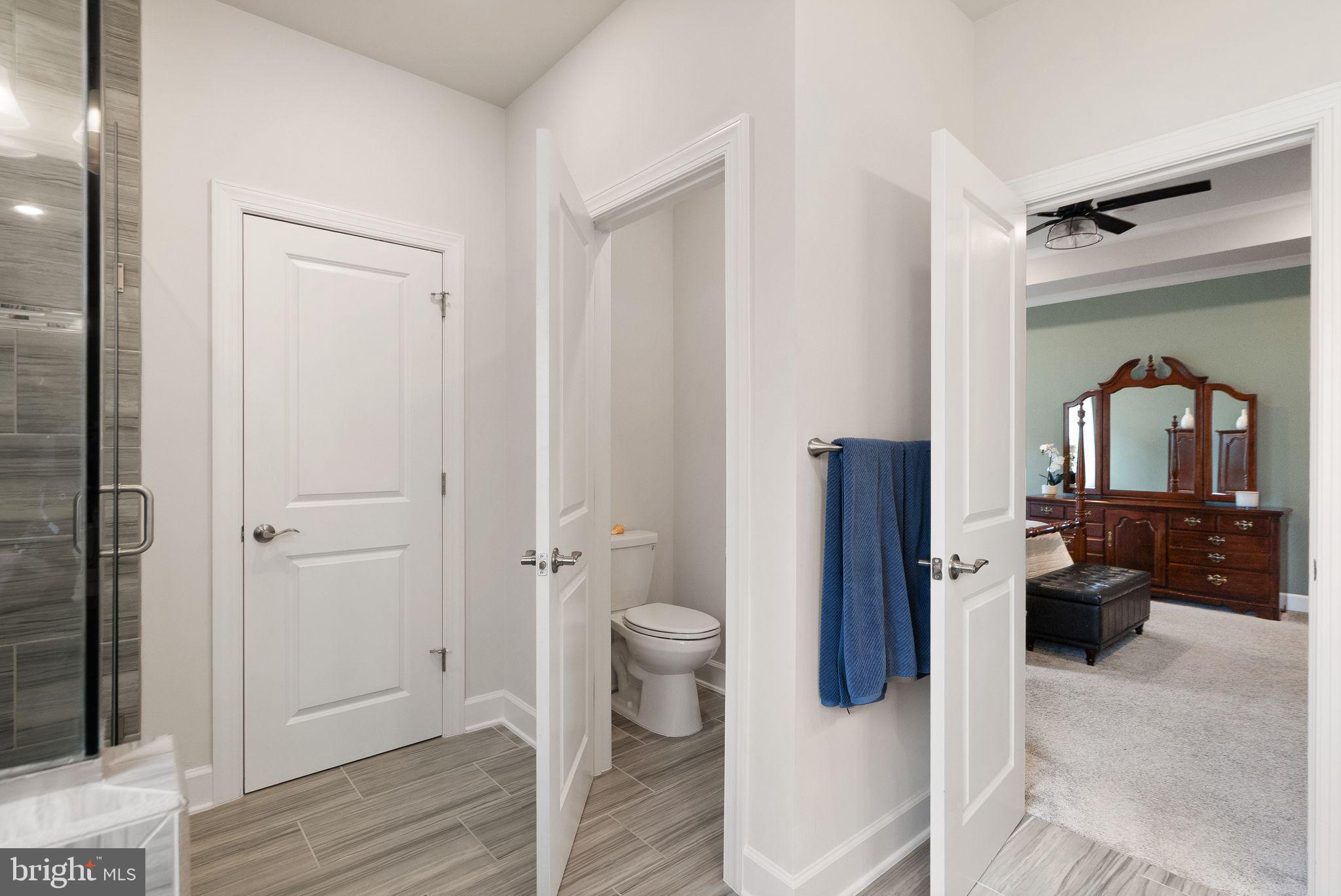 9516 Sanger Street Lorton, VA 22079 - Photo 22 of 45 a bathroom with a toilet and a shower