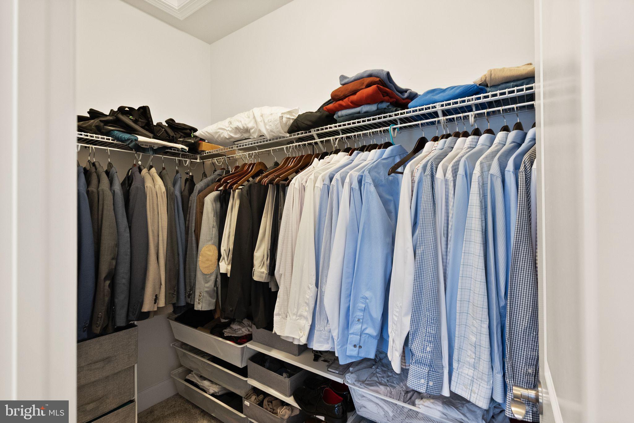 9516 Sanger Street Lorton, VA 22079 - Photo 24 of 45 a view of walk in closet with clothes