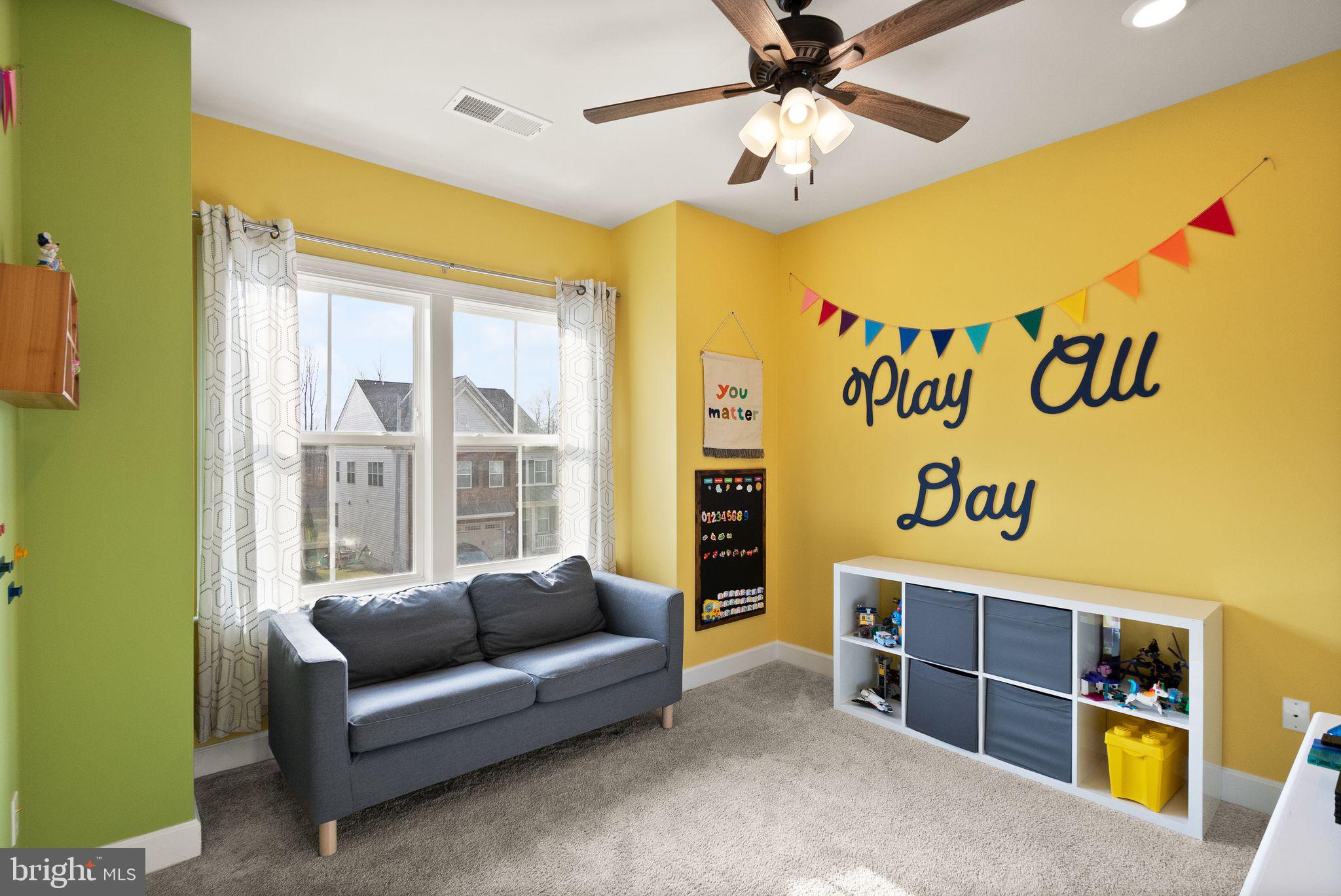 9516 Sanger Street Lorton, VA 22079 - Photo 28 of 45 a bedroom with furniture and a window