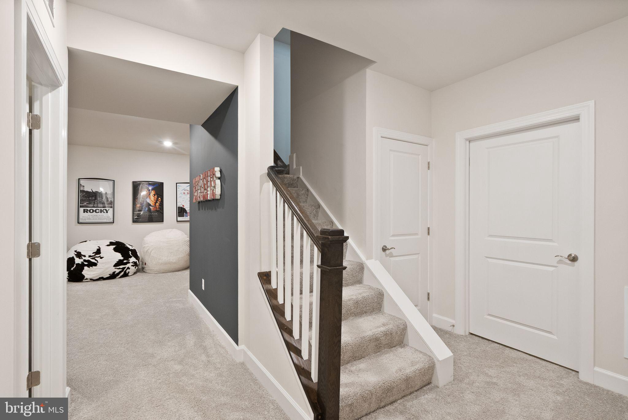 9516 Sanger Street Lorton, VA 22079 - Photo 34 of 45 a view of a livingroom with wooden floor and stairs