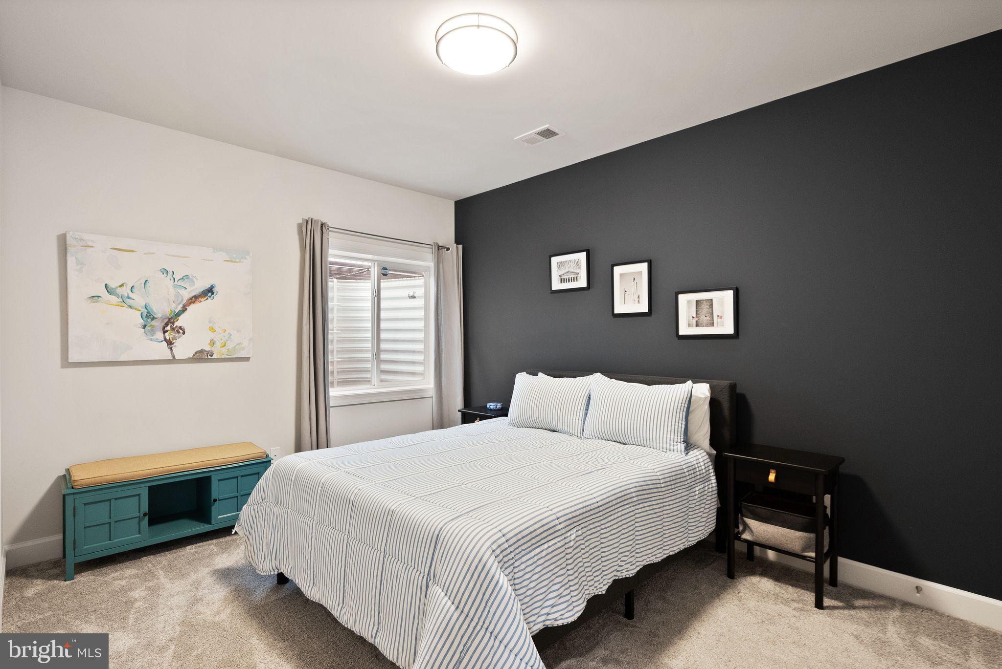 9516 Sanger Street Lorton, VA 22079 - Photo 37 of 45 a bedroom with a bed and a window