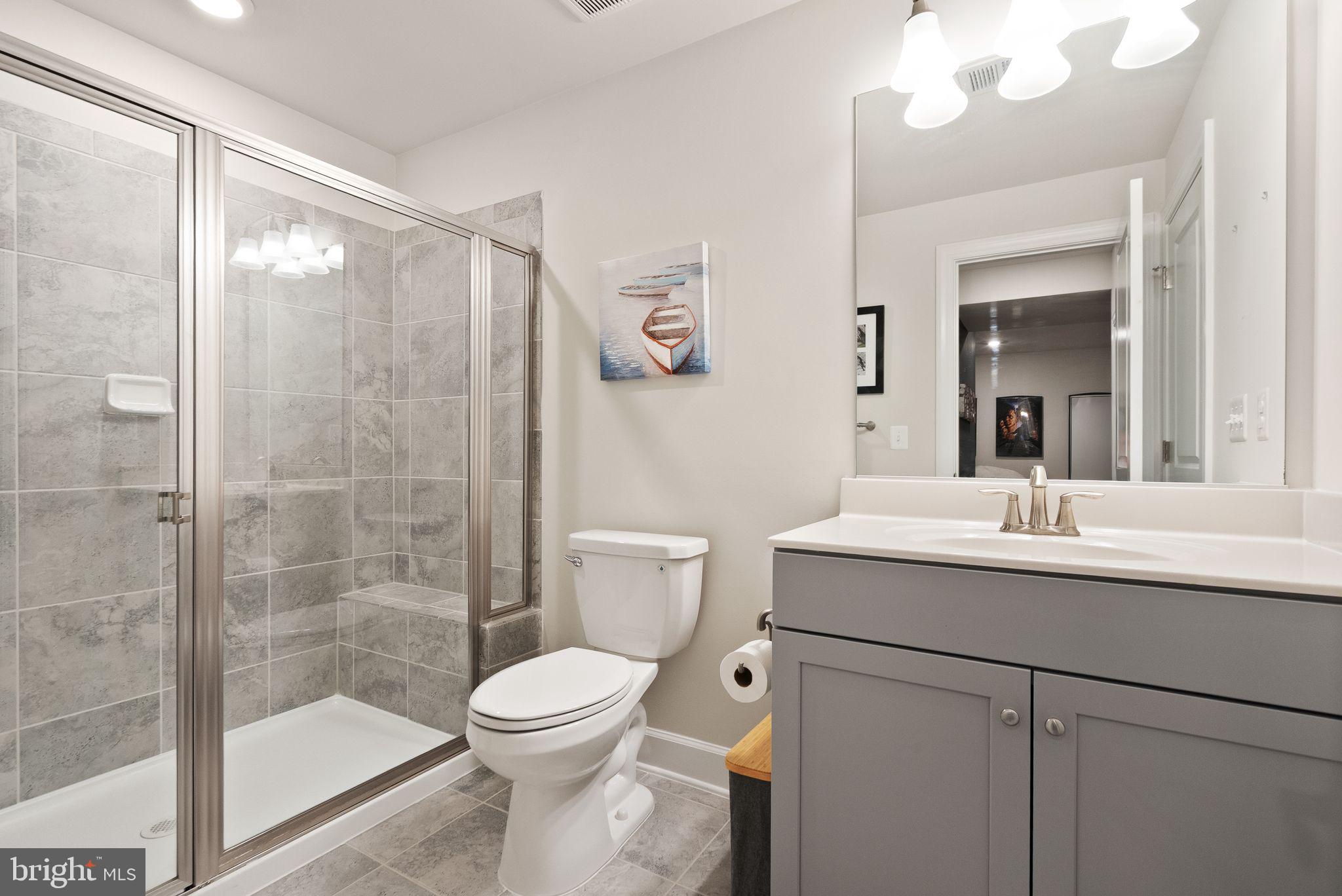 9516 Sanger Street Lorton, VA 22079 - Photo 38 of 45 a bathroom with a sink and a mirror