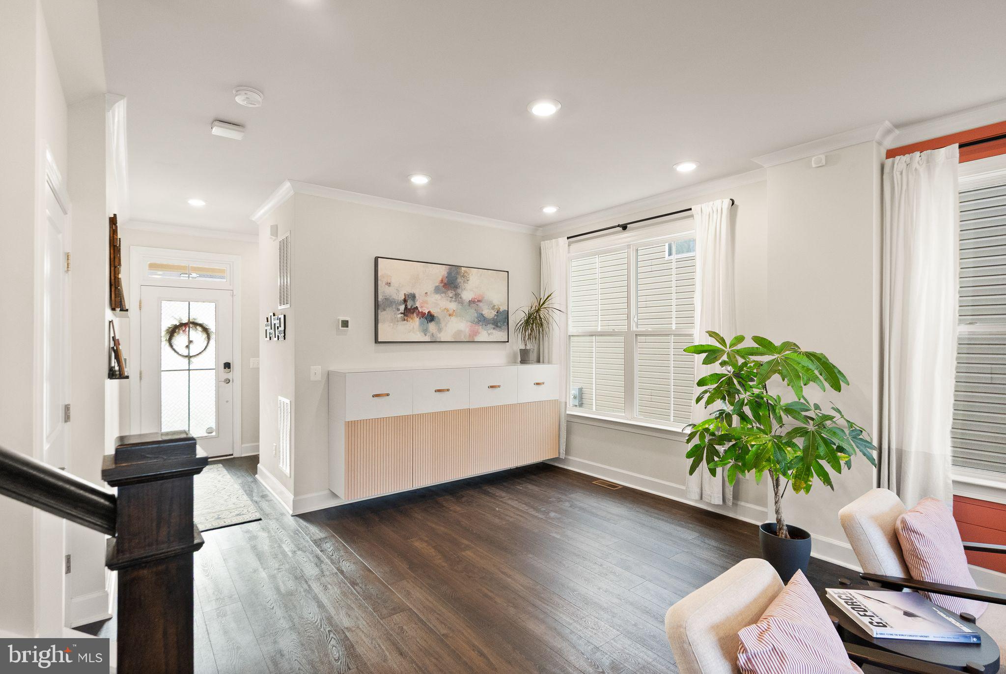9516 Sanger Street Lorton, VA 22079 - Photo 5 of 45 a living room with furniture and a potted plant