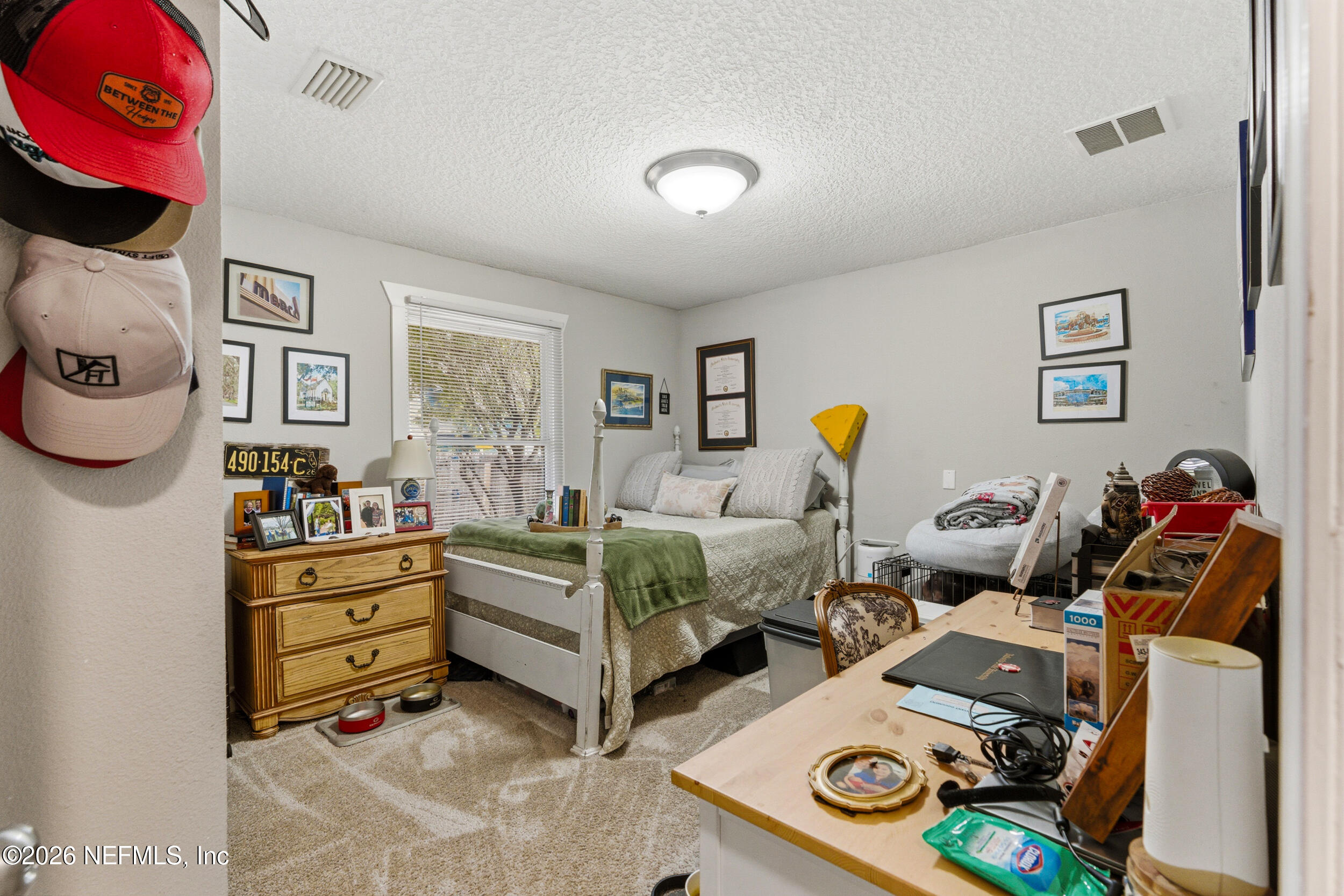 5188 Tan Street Jacksonville, FL 32258 - Photo 19 of 24 a bedroom with bed and a window