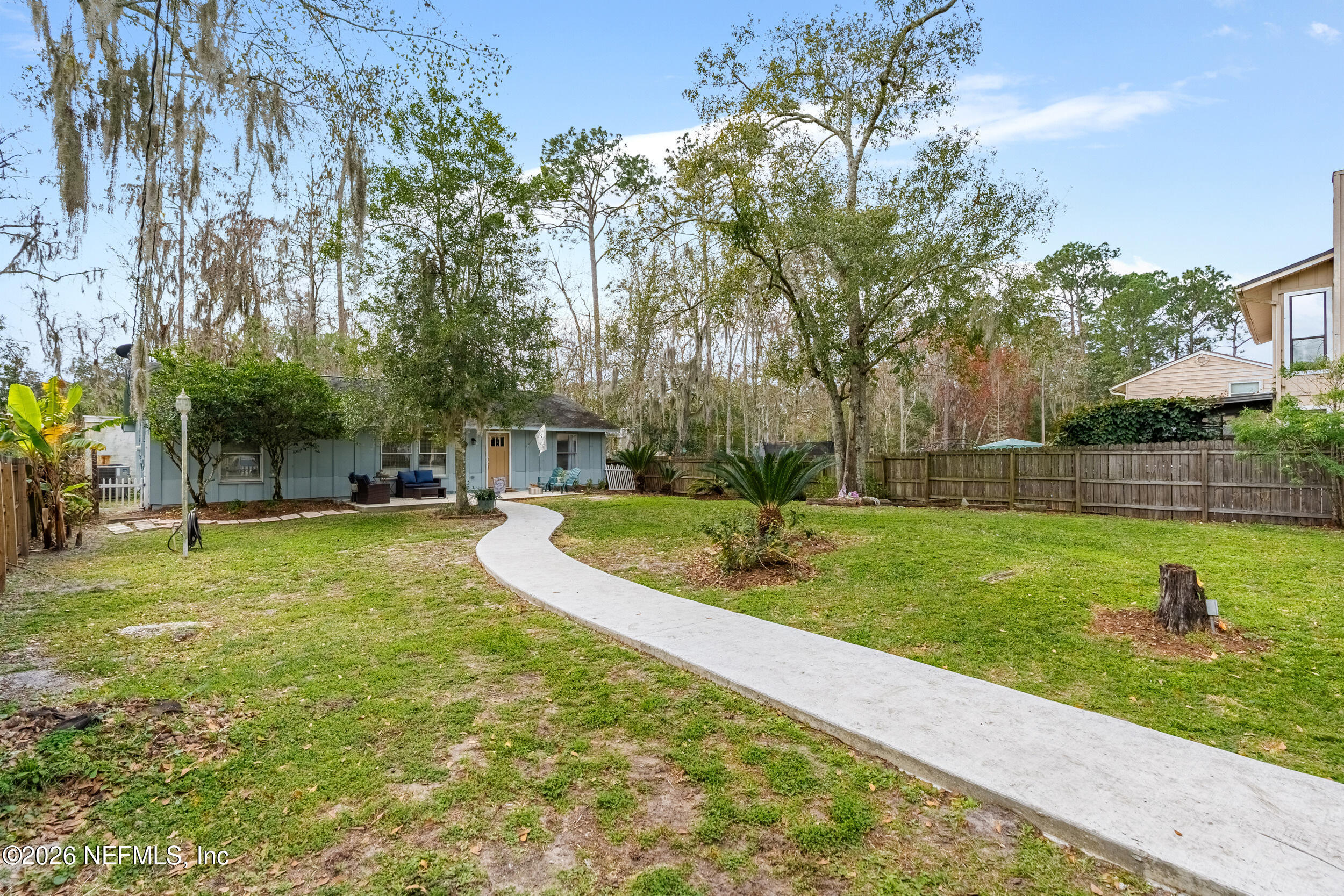 5188 Tan Street Jacksonville, FL 32258 - Photo 2 of 24 a view of a garden with trees