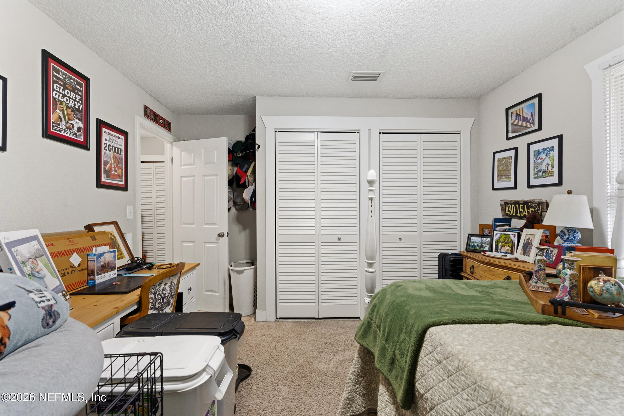 5188 Tan Street Jacksonville, FL 32258 - Photo 21 of 24 a bedroom with a bed and furniture