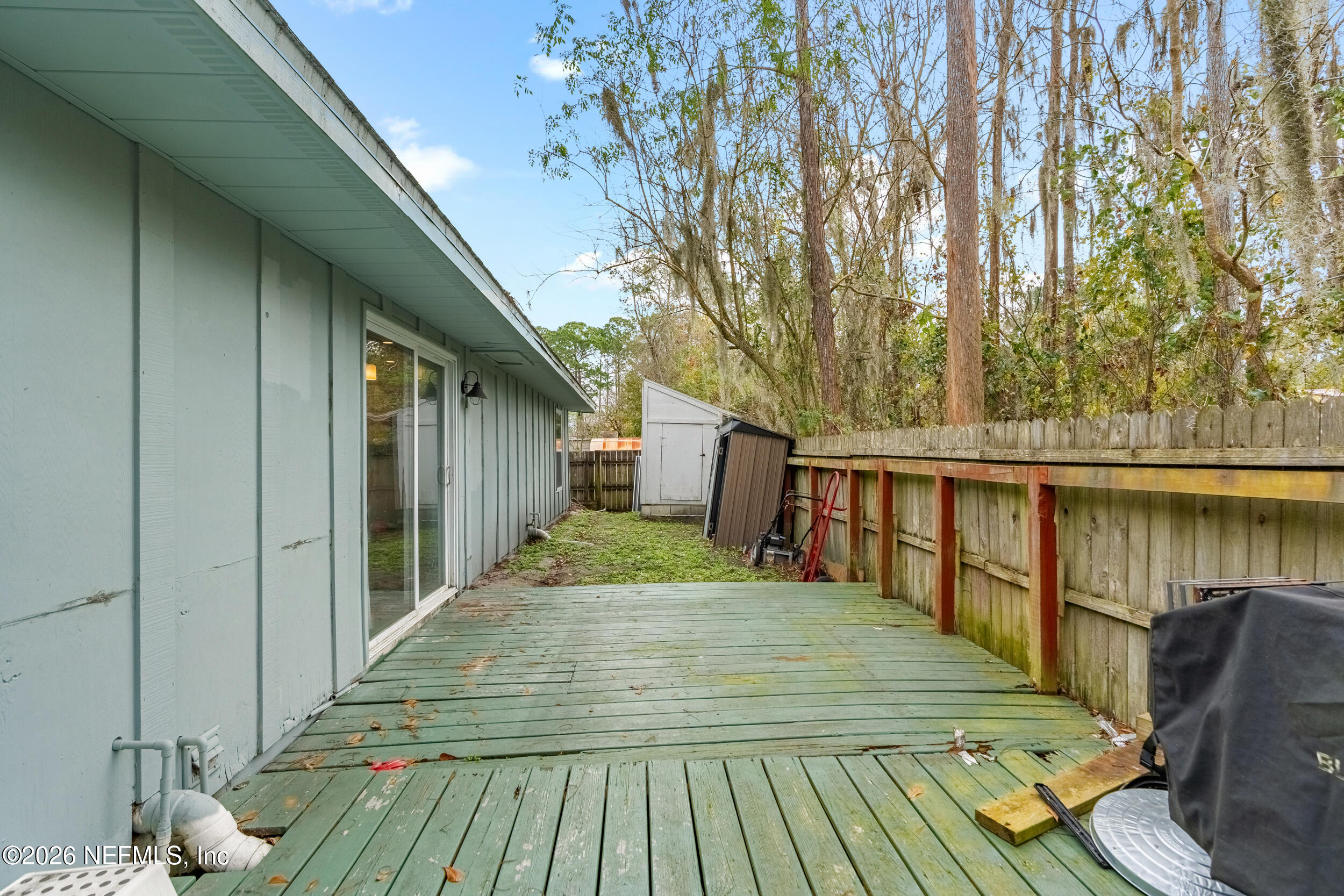 5188 Tan Street Jacksonville, FL 32258 - Photo 23 of 24 a balcony with wooden floor