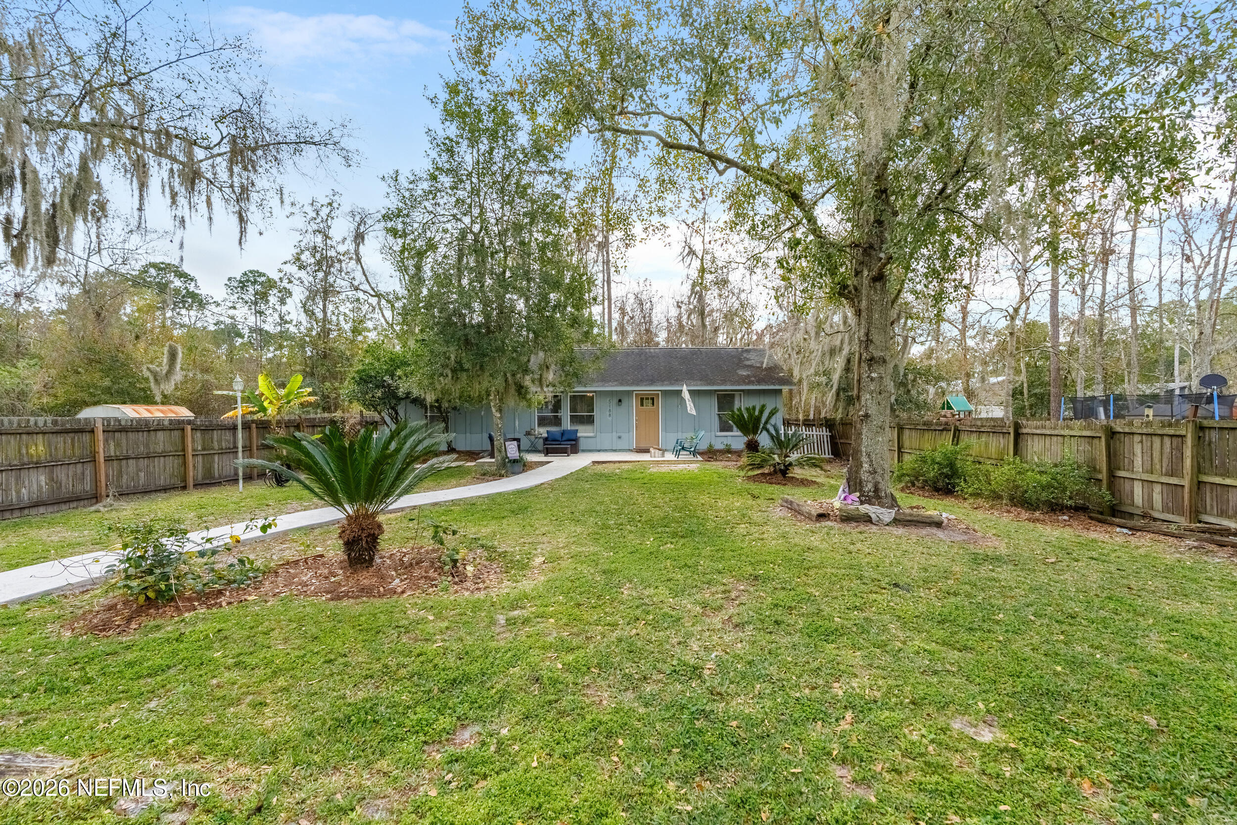 5188 Tan Street Jacksonville, FL 32258 - Photo 3 of 24 a view of a house with a yard and sitting area