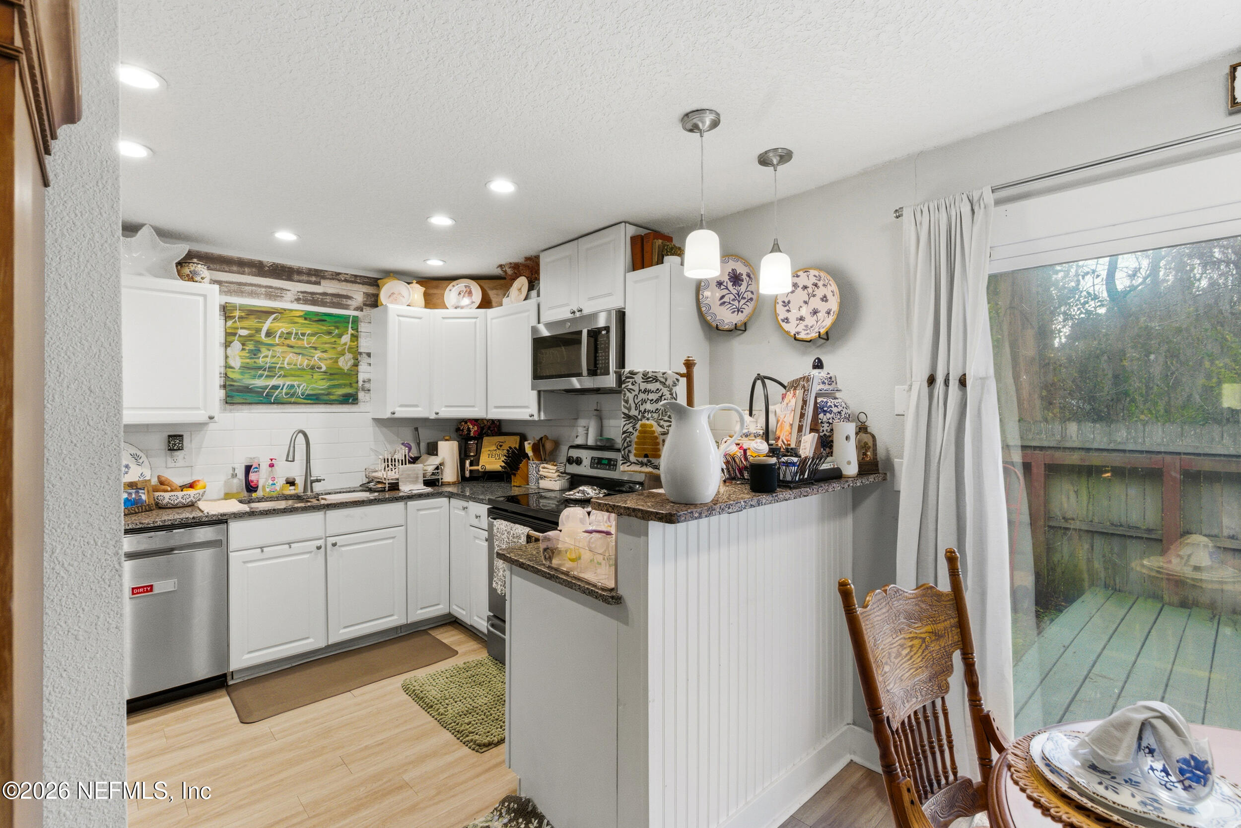5188 Tan Street Jacksonville, FL 32258 - Photo 9 of 24 a kitchen with stainless steel appliances granite countertop a sink and cabinets