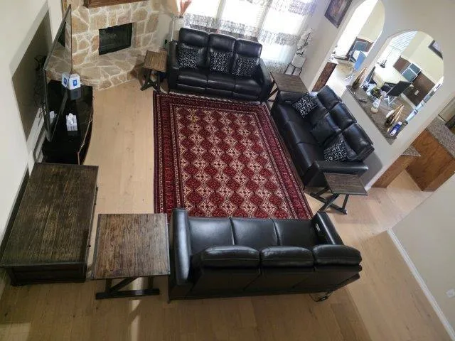 a living room with furniture and a fireplace