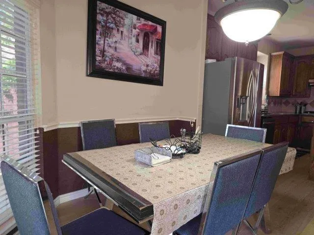 a view of a dining room with furniture