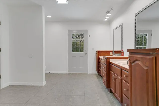an entryway with a washer and dryer