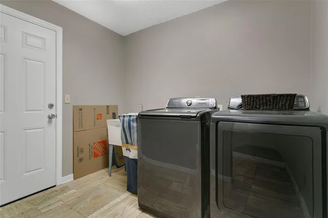 a utility room with washer and dryer