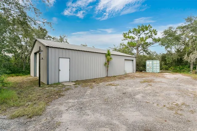 a view of a house with a tree
