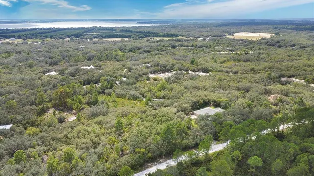 a view of a yard with an ocean