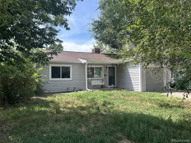 a backyard of a house with large trees