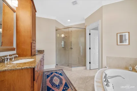 a bedroom with a sink and a mirror