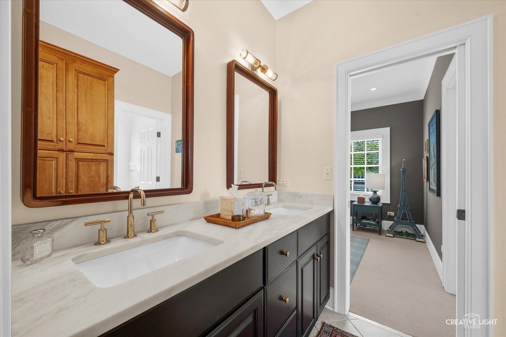 920 North Washington Street Wheaton, IL 60187 - Photo 29 of 43 a bathroom with a sink double vanity and a mirror