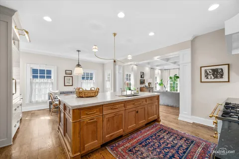 a kitchen with granite countertop a sink and cabinets