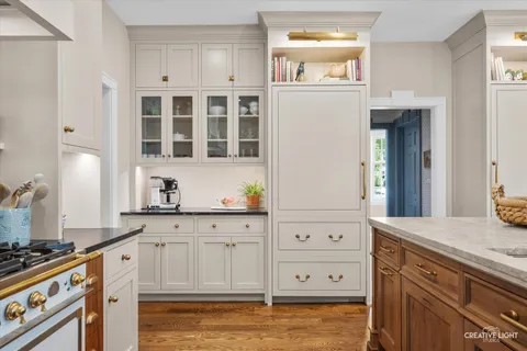 a kitchen with stainless steel appliances granite countertop a stove and a refrigerator