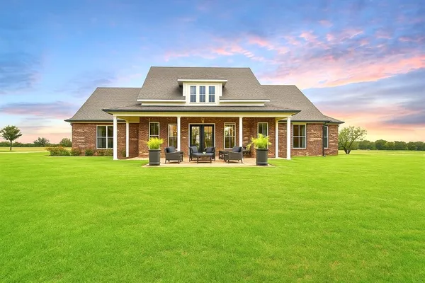 front view of a house with a yard