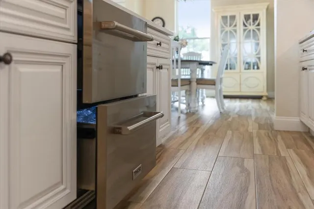 a view of a livingroom with furniture and a dining table
