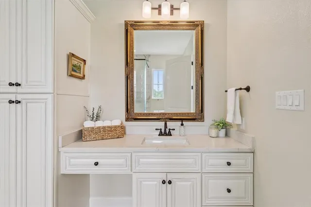 a bathroom with a sink and a mirror