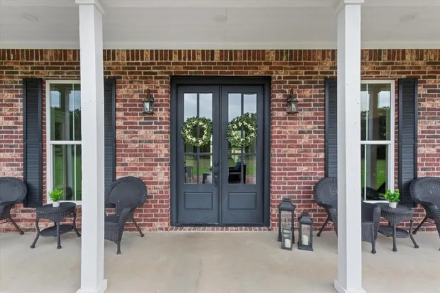 a kitchen with stainless steel appliances granite countertop a stove and white cabinets