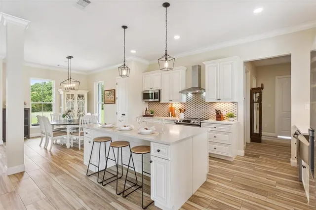 a kitchen with a sink and a stove