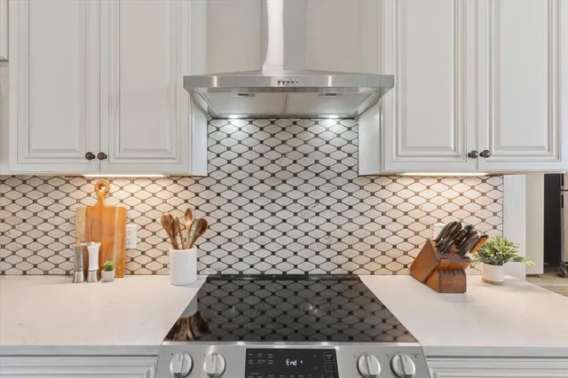 a view of a vase of flowers sitting on a shelf