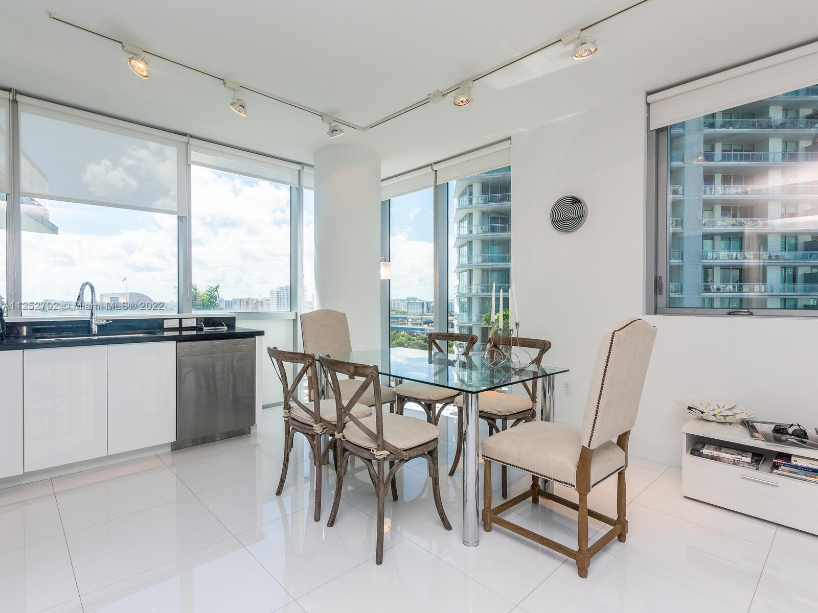 92 Southwest 3rd Street, Unit 1510 Miami, FL 33130 - Photo 22 of 90 a view of a dining room with furniture window and outside view