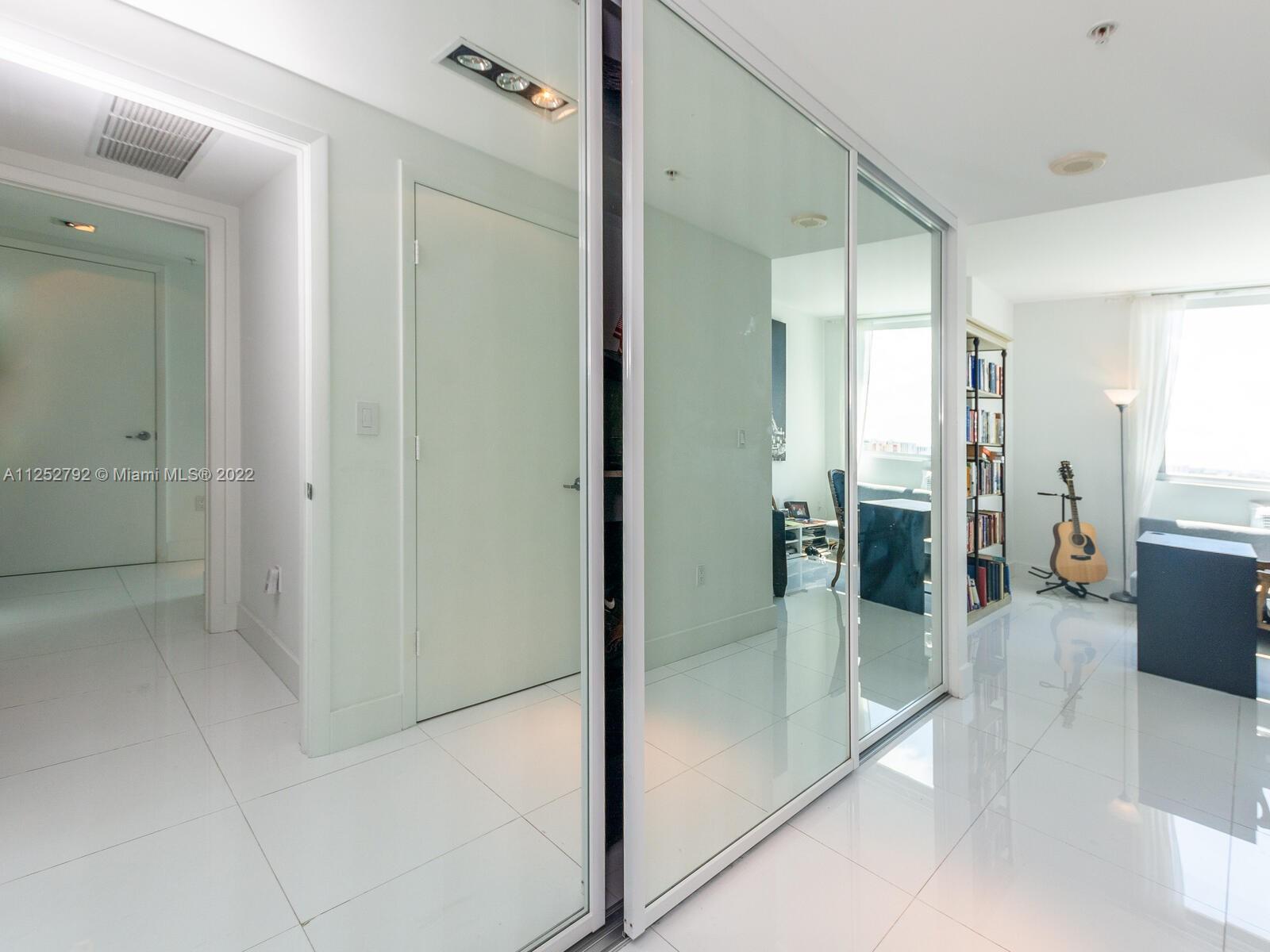 92 Southwest 3rd Street, Unit 1510 Miami, FL 33130 - Photo 32 of 90 a bathroom with a glass shower door