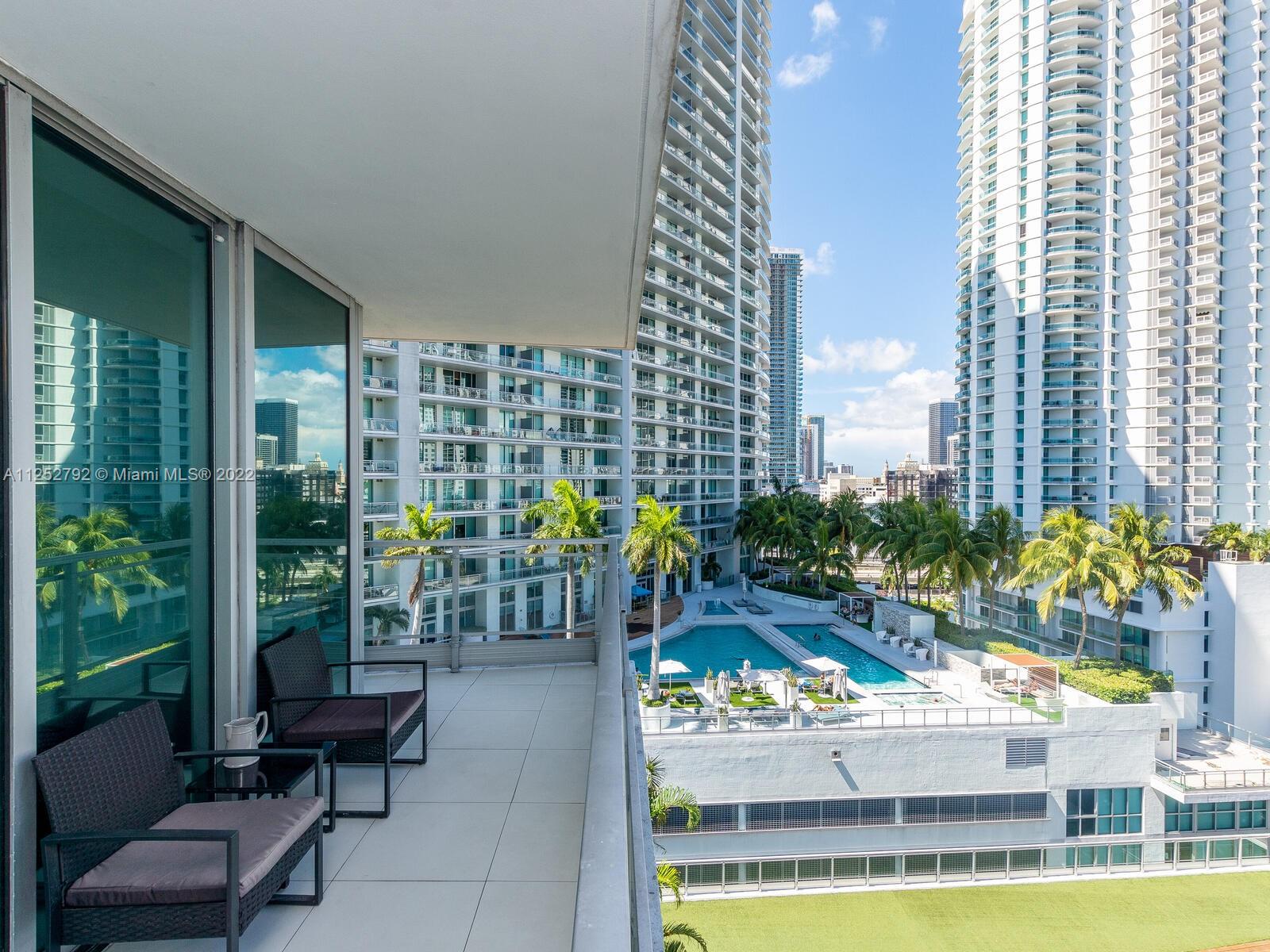 92 Southwest 3rd Street, Unit 1510 Miami, FL 33130 - Photo 50 of 90 a view of swimming pool with chairs