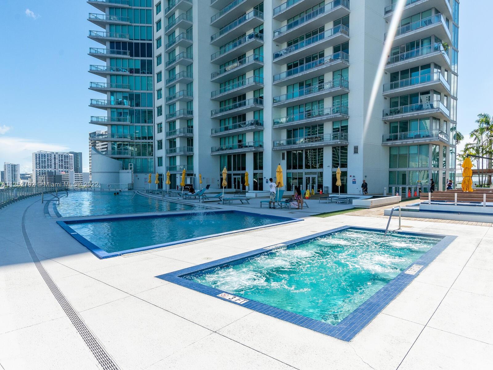 92 Southwest 3rd Street, Unit 1510 Miami, FL 33130 - Photo 71 of 90 a view of swimming pool with building in the background