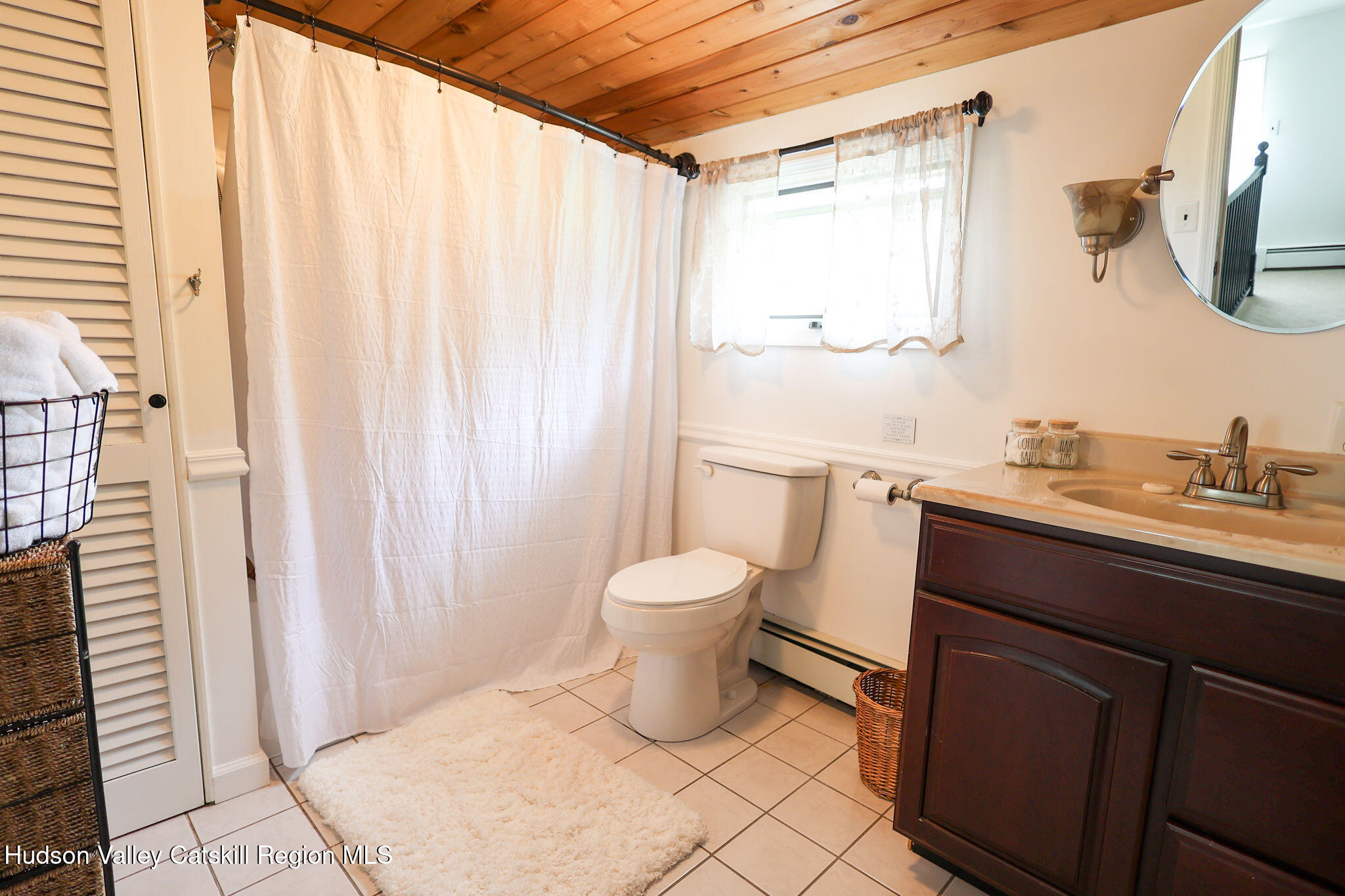 523 Mitchell Hollow Road Windham, NY 12496 - Photo 25 of 59 a bathroom with a granite countertop sink a toilet and a mirror