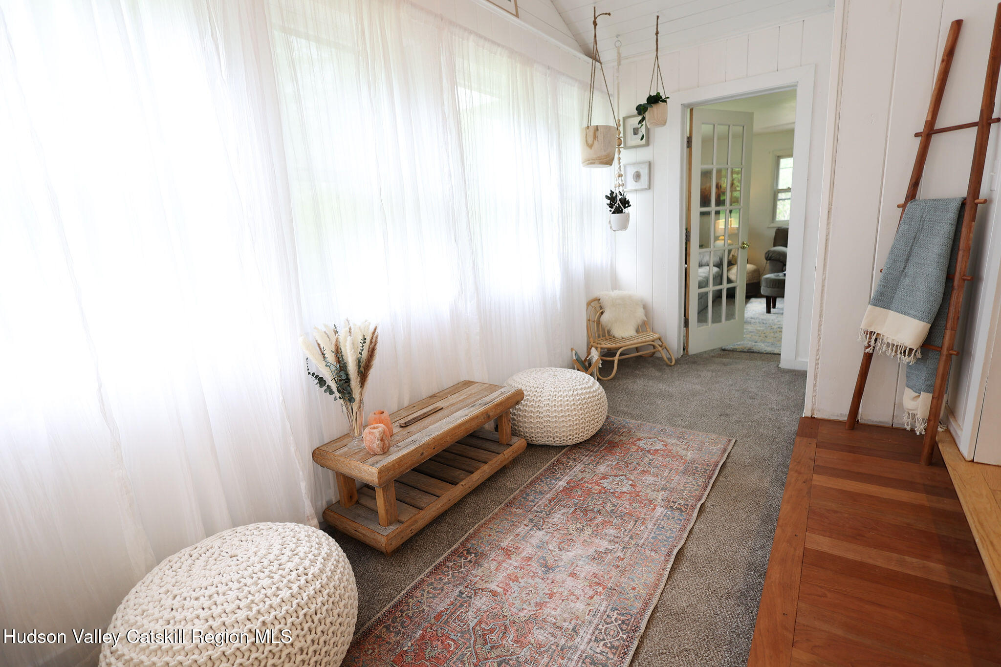 523 Mitchell Hollow Road Windham, NY 12496 - Photo 27 of 59 a living room with furniture and a rug
