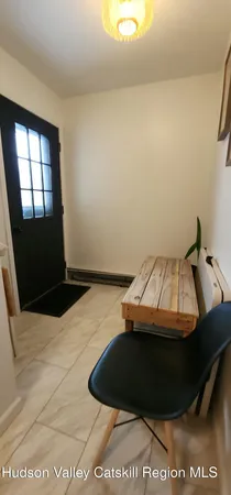 a view of deck with mountain view and wooden floor