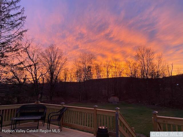 523 Mitchell Hollow Road Windham, NY 12496 - Photo 37 of 59 a view of deck with mountain view and wooden floor