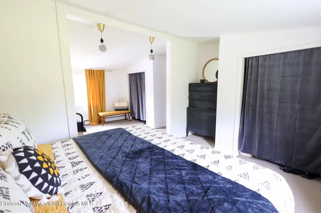 a bedroom with bed and window