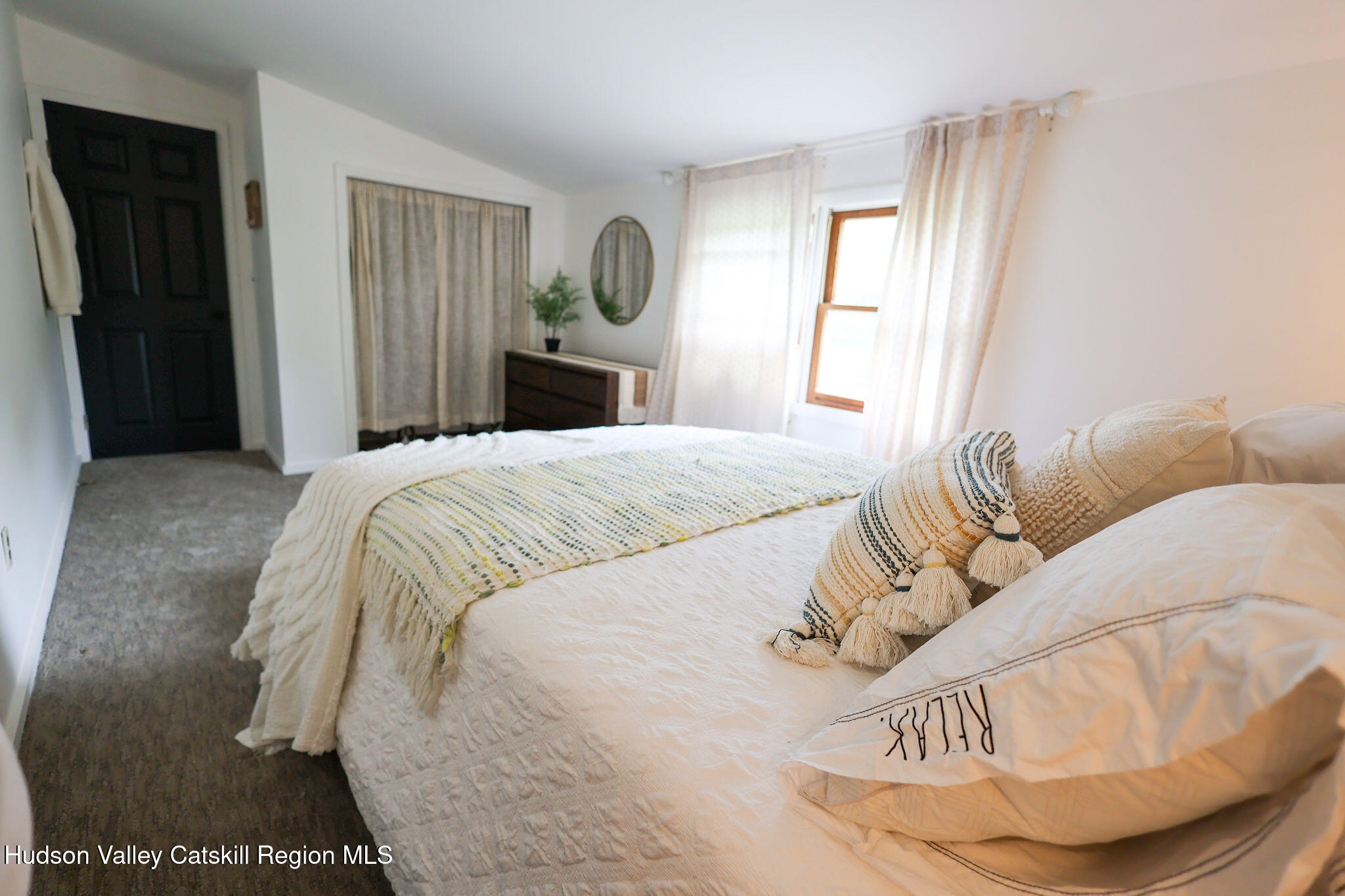 523 Mitchell Hollow Road Windham, NY 12496 - Photo 46 of 59 a bedroom with a bed and wooden floor