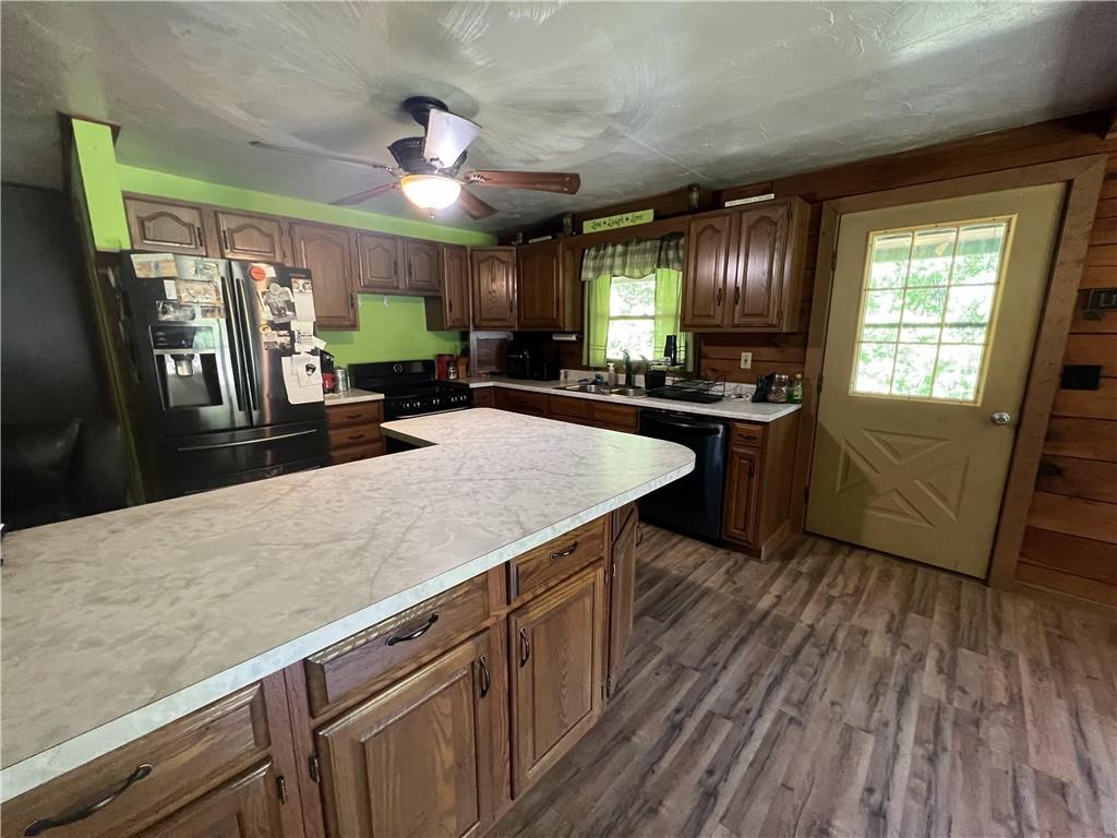 1149 School Road Apollo, PA 15613 - Photo 17 of 32 a kitchen with stainless steel appliances granite countertop sink stove top oven and cabinets