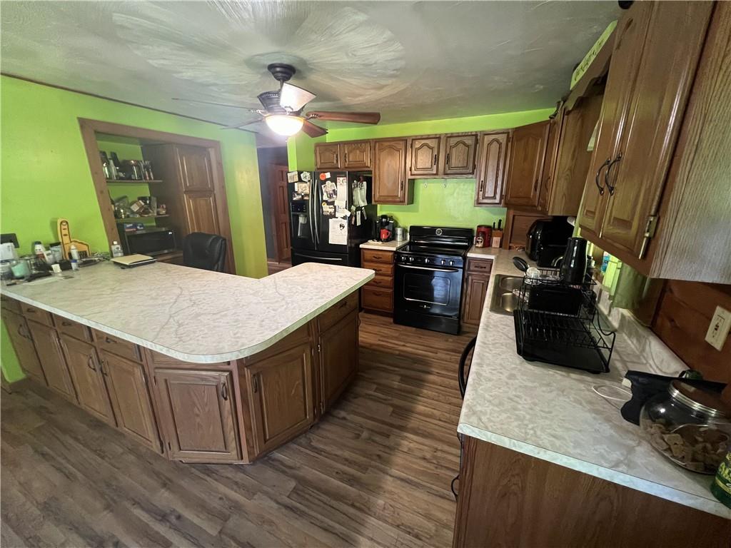 1149 School Road Apollo, PA 15613 - Photo 18 of 32 a kitchen with sink stove and wooden floor