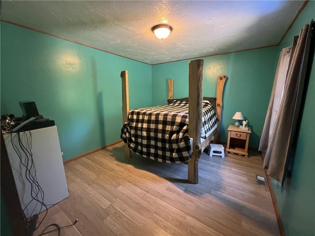 1149 School Road Apollo, PA 15613 - Photo 20 of 32 a bedroom with a bed and a mirror