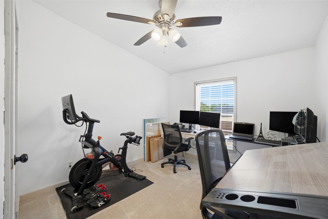 4048 Sutherland Springs Road Seguin, TX 78155 - Photo 12 of 23 a view of a workspace with furniture and a window