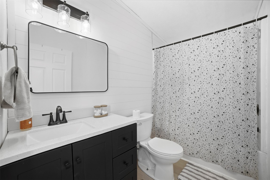 4048 Sutherland Springs Road Seguin, TX 78155 - Photo 19 of 23 a bathroom with a toilet sink and mirror