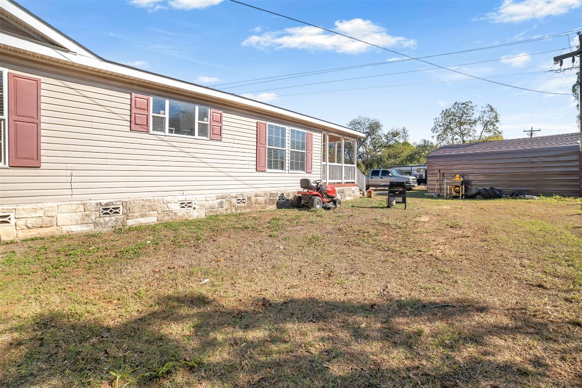 4048 Sutherland Springs Road Seguin, TX 78155 - Photo 23 of 23 a view of a house with backyard and sitting area